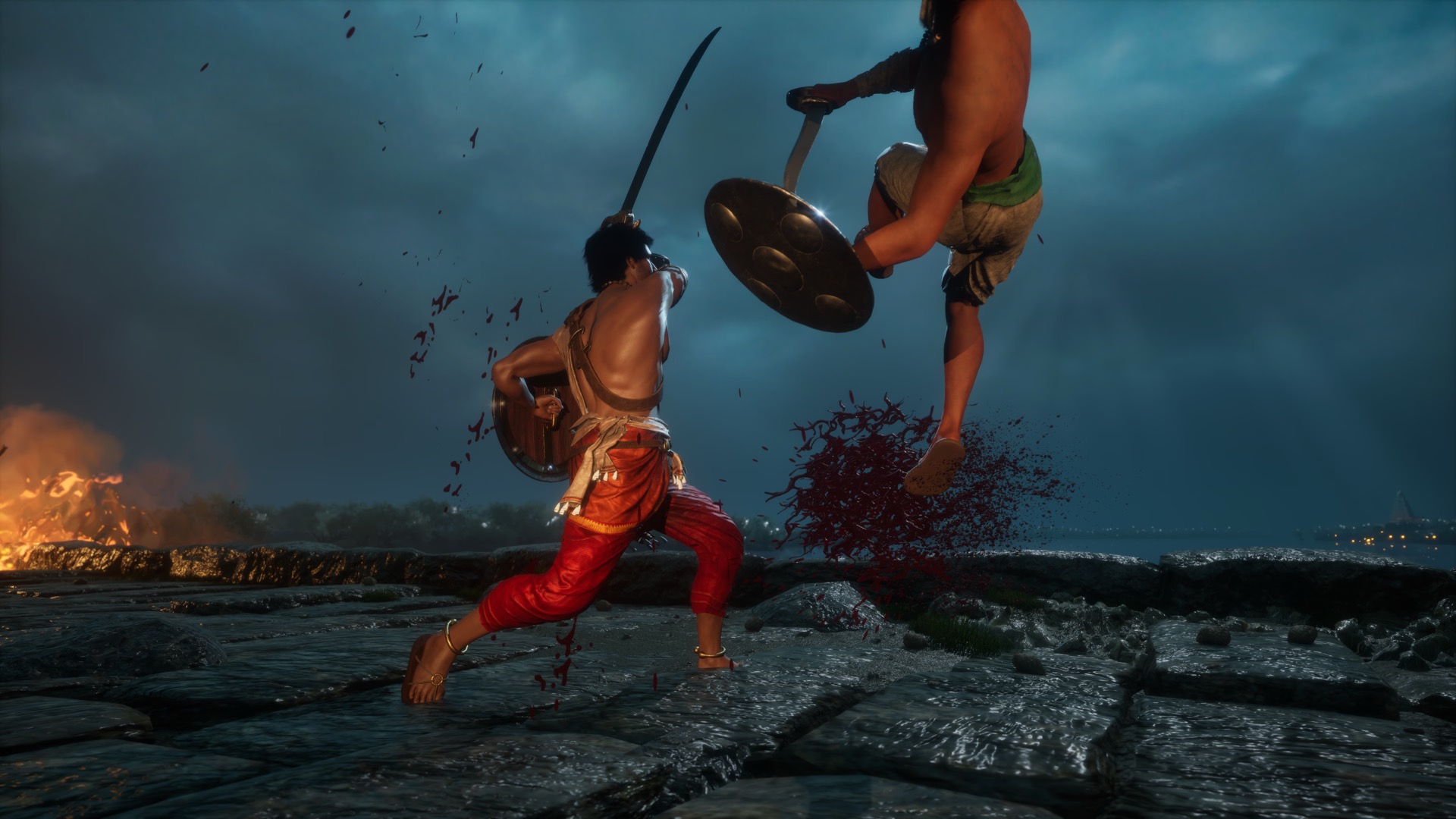 Son of Thanjai — combat scene with Rajendra Chola fighting on rocky terrain